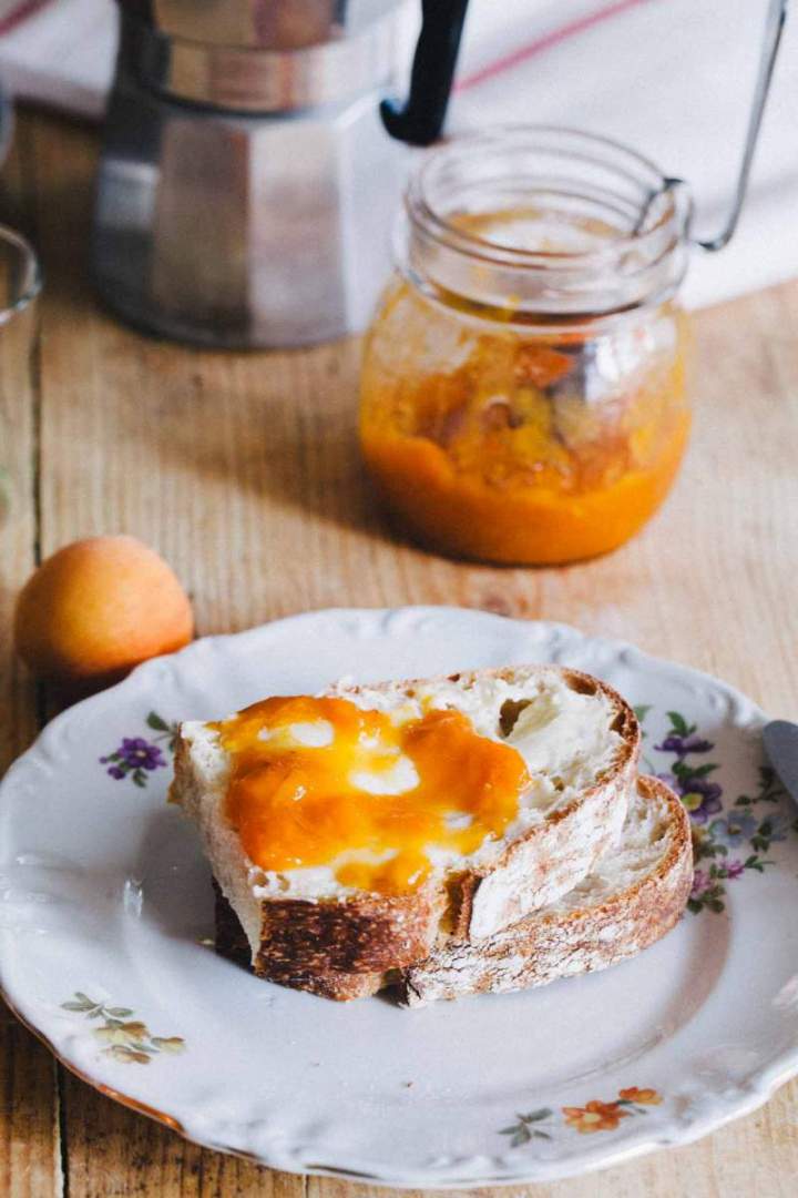 Apricot jam with vanilla spread over homemade bread