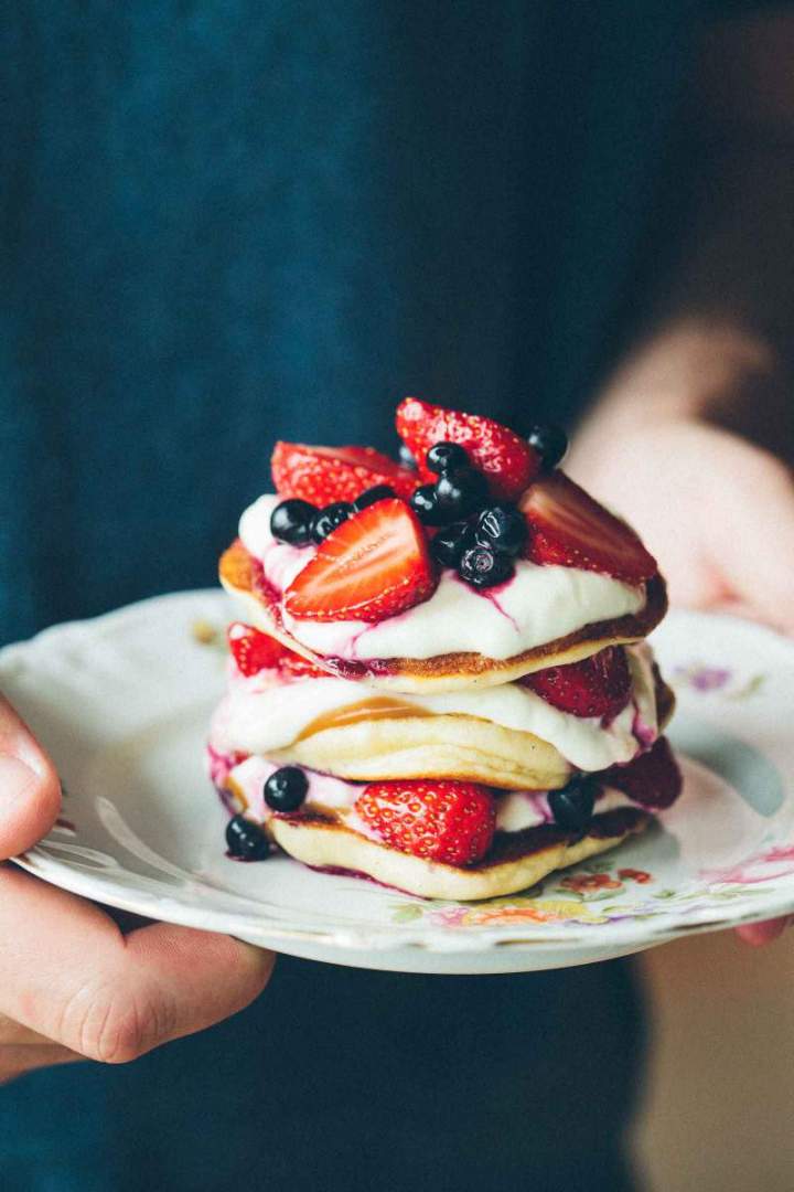 The fluffiest pancakes with strawberries and blueberries
