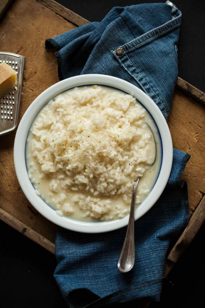 Risotto bianco served with parmesan cheese in a bowl