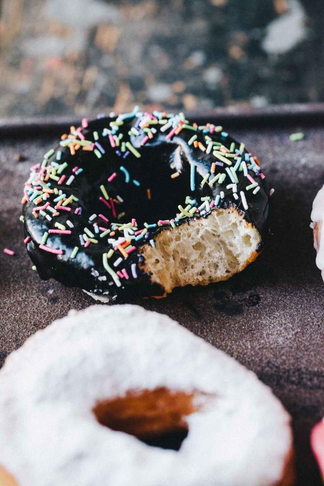Sourdough doughnuts with chocolate and other colorful glazes