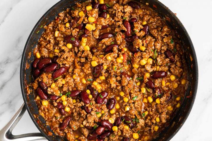 Ground Beef sauce for enchiladas with corn and beans