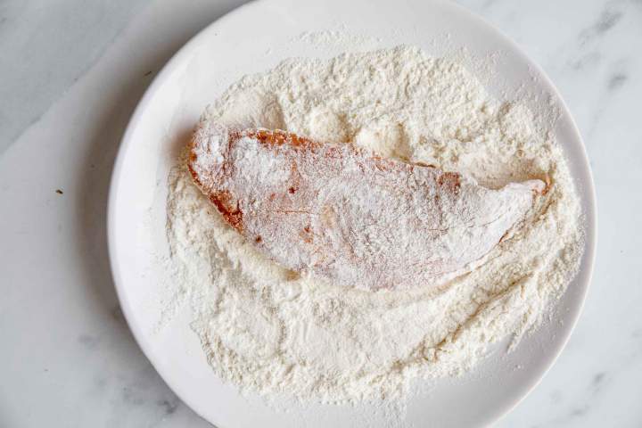 Coating fish in flour for Deep fried hake