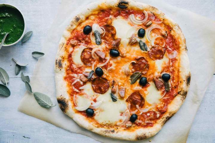 Fall pepperoni pizza with onion and sage