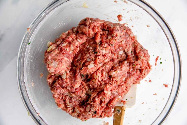 preparing meat stuffing for Stuffed Bell Peppers with Tomato Sauce