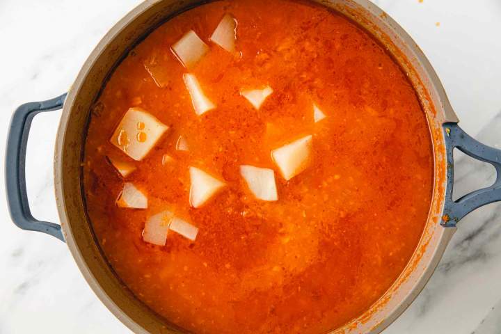 Adding potatoes to Best Brodet (Fish Stew)