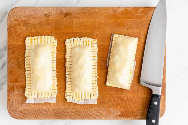 Homemade Fried Apple Pies made from scratch cutting off the edges