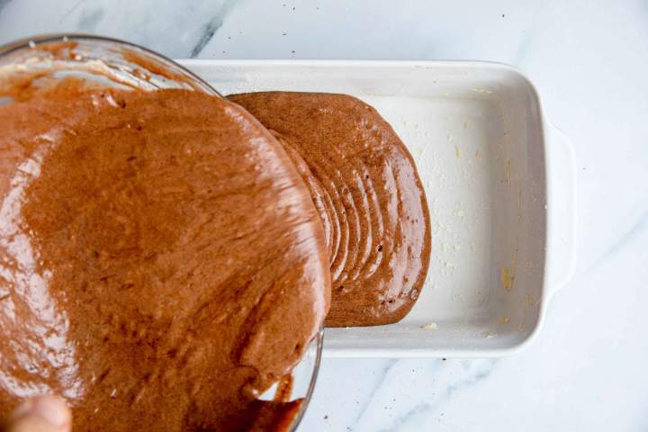 Pouring chocolate batter in the baking dish