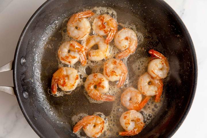 Frying shrimp for Ginger Scallion Noodles with Shrimp