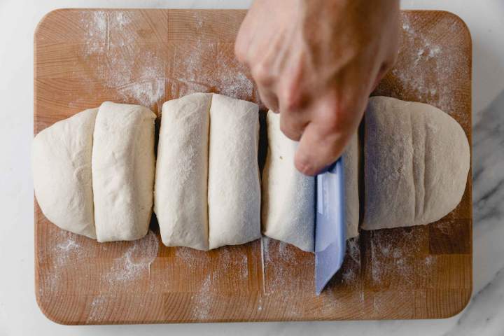 Dividing the dough for Lepinja (Balkan Flatbread) into six parts