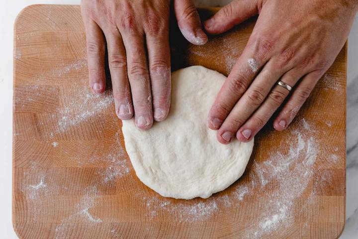 Shaping the dough into Lepinja (Balkan Flatbread)
