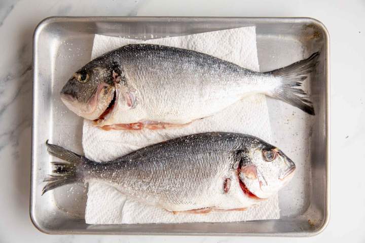 preparing sea bream for Oven-Baked Sea Bream with Potatoes