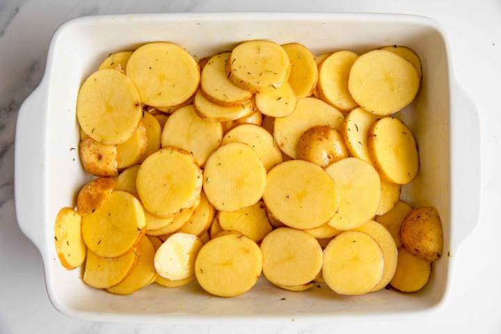 Baking potatoes for Oven-Baked Sea Bream with Potatoes