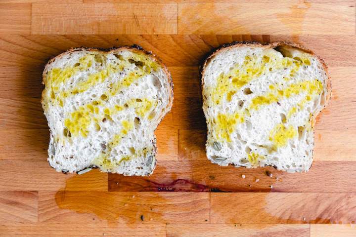 toasting bread for Whipped Ricotta Tomato Toast