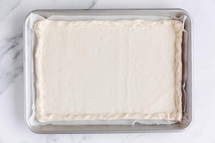 Preparing puff pastry for Asparagus Tart with Cream Cheese