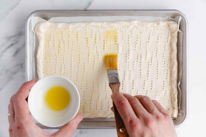 Preparing puff pastry for Asparagus Tart with Cream Cheese
