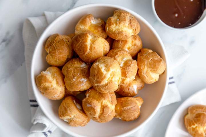 Filling profiteroles with cream