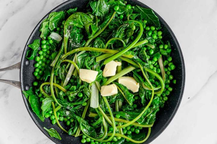 Adding butter to Sauteed Swiss Chard with Peas