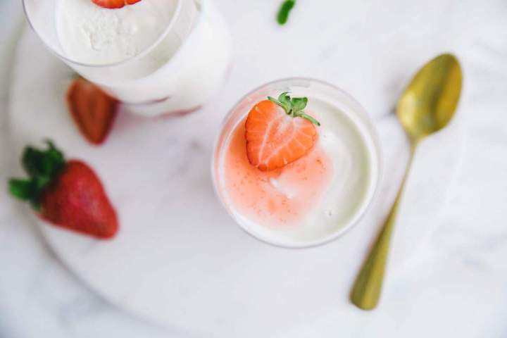 Yogurt Mousse in a glass jar with strawberries