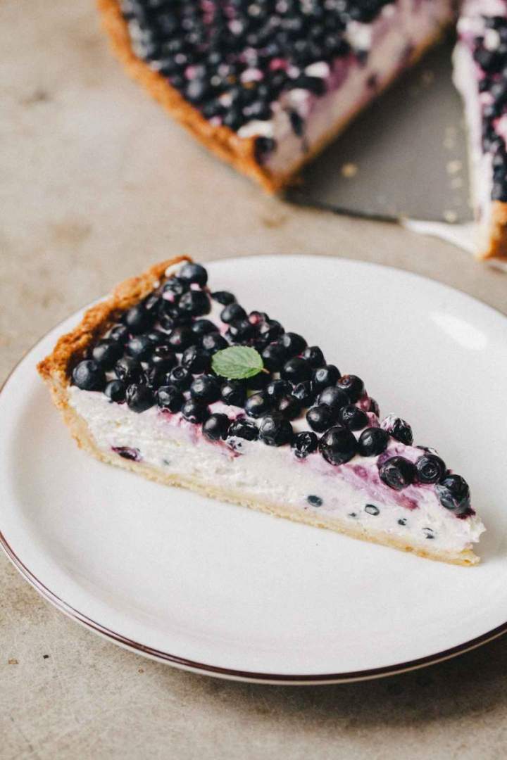 Slice of Homemade Blueberry Tart with Light Yogurt Cream