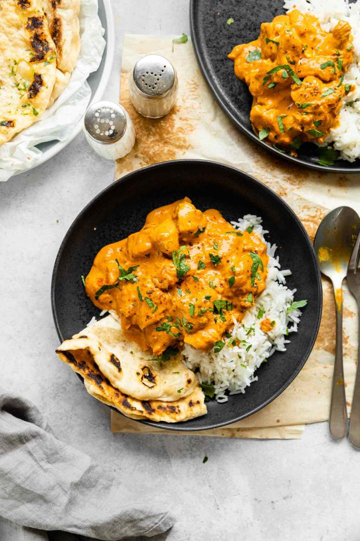 Chicken Tikka Masala with rice and chopped parsley