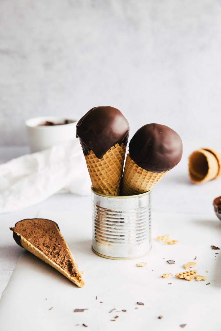 Chocolate Swiss Meringue Buttercream Filled Cones, dipped in chocolate