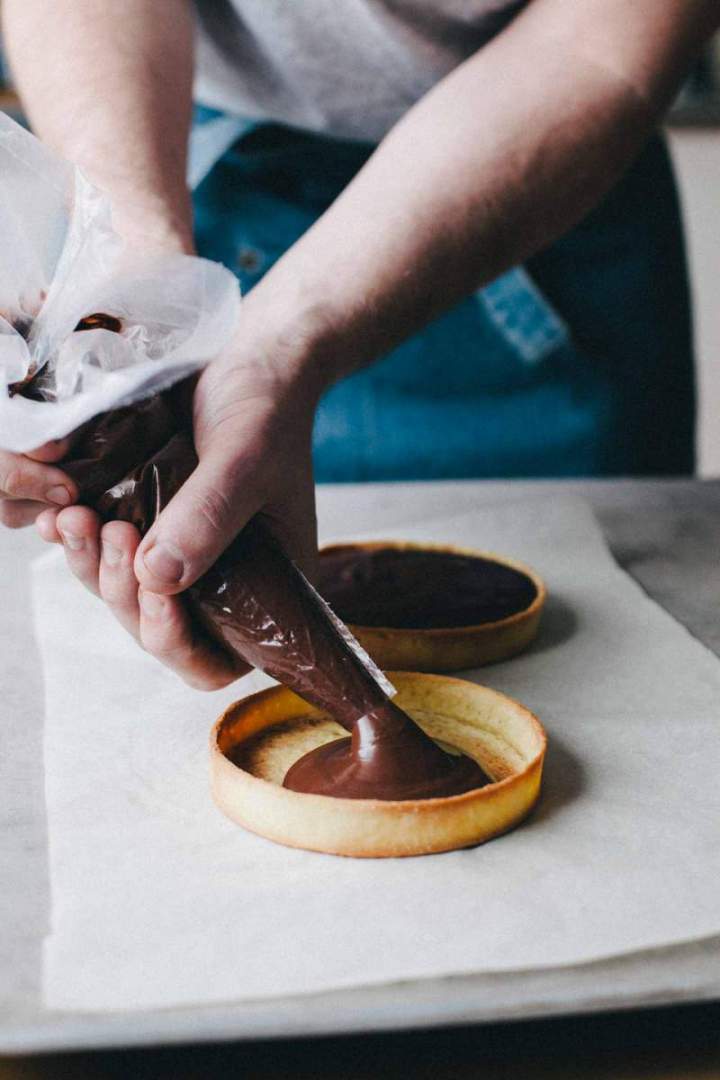 Pipping chocolate into prebaked tart shells