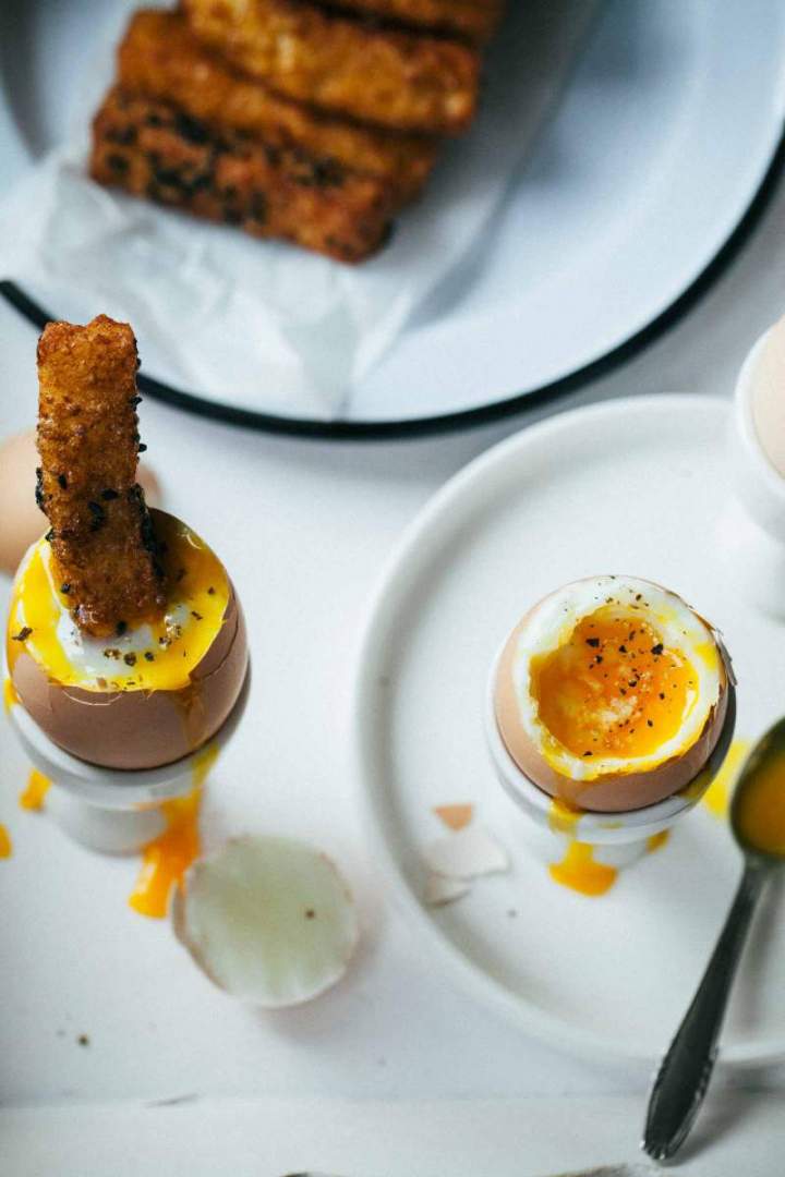 Dippy eggs and savory french toast served for breakfast