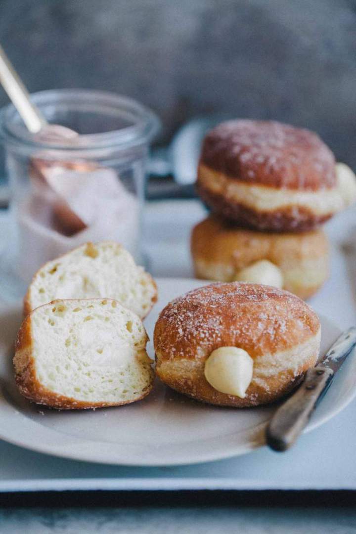 Homemade Brioche Doughnuts with rich vanilla cream and a fluffy, soft inside