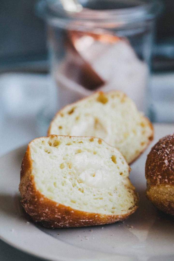 Homemade Brioche Doughnuts with rich vanilla cream and a fluffy, soft inside