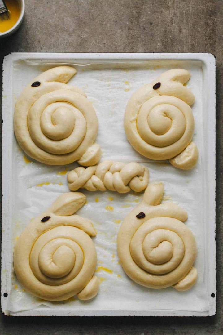 Shaped Easter bunny shaped rolls before baking