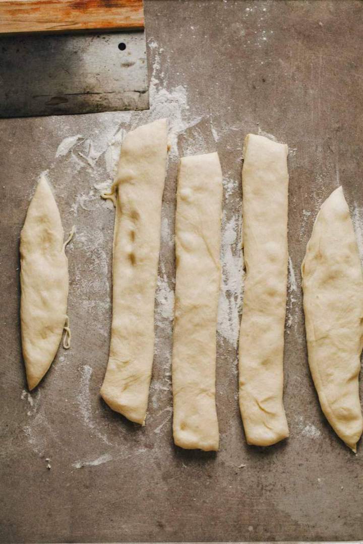 Five pieces of dough for Easter bunny shaped rolls