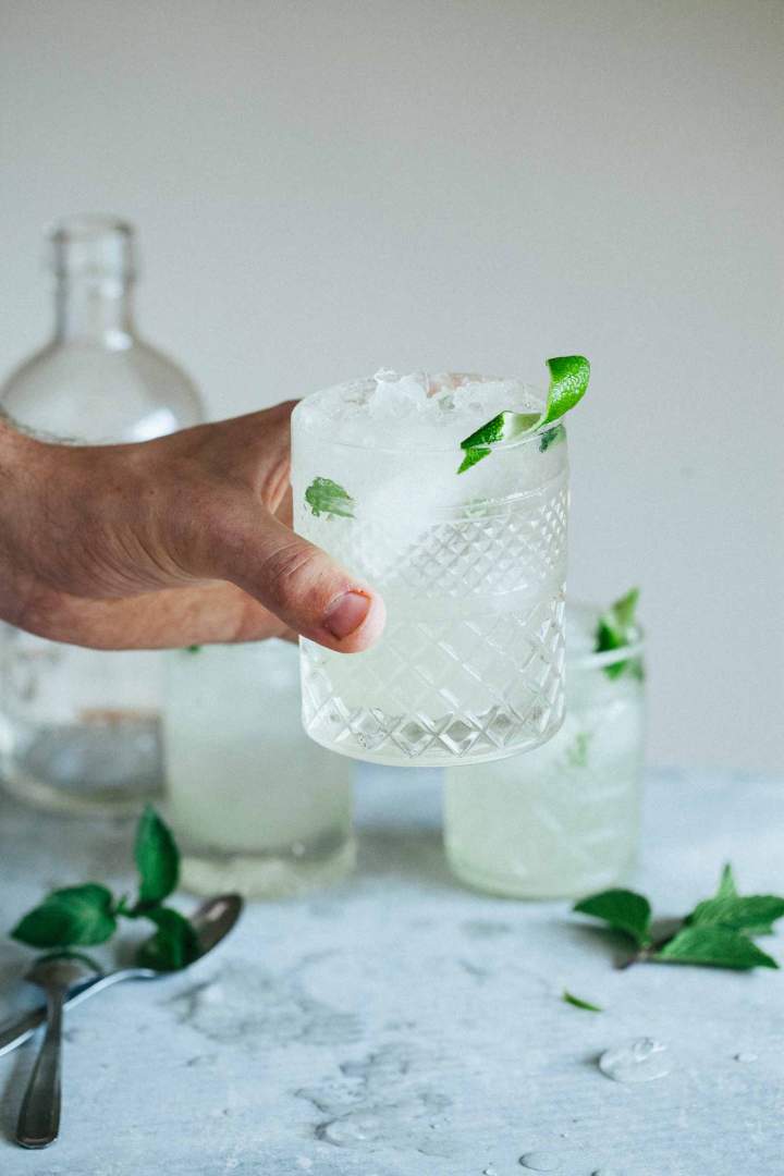 Elderflower mojito cocktail served with lime in a glass