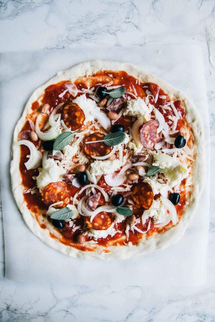 Fall pepperoni pizza with onion and sage