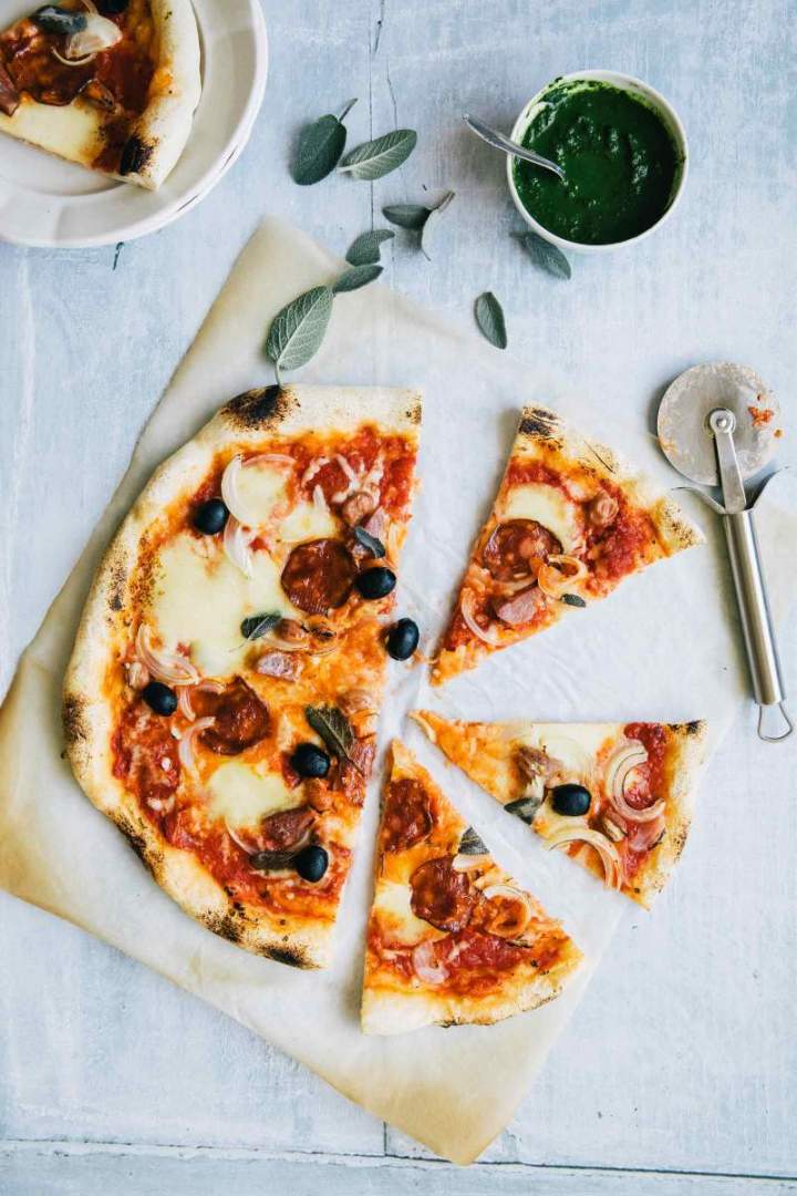 Fall pepperoni pizza with onion and sage