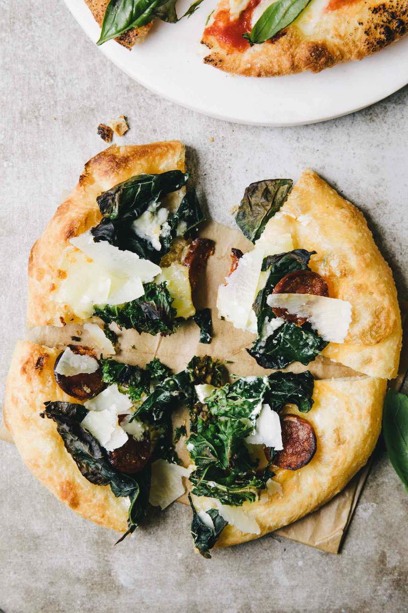 Fried pizza dough with kale, chorizo, mozzarella cheese, gorgonzola and parmesan cheese
