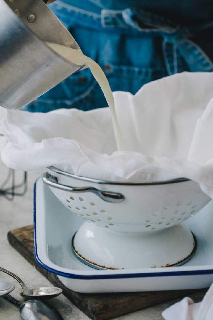 Pouring the mixture for Homemade Mascarpone into a bowl