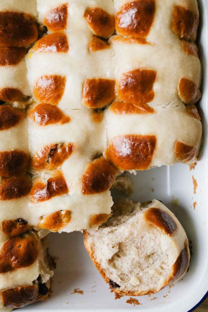 Baked hot cross buns in a baking dish