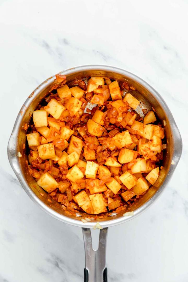 Cooking potatoes and spices for Shrimp Stew with Potatoes and Chickpeas