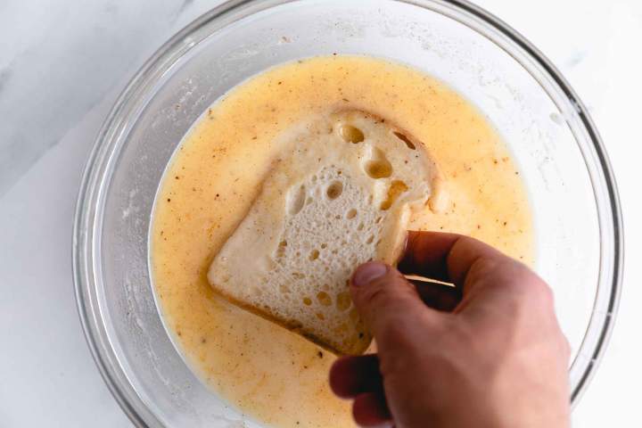 Soaking the bread for Vanilla Bread Pudding