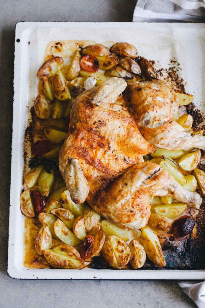 Baked Roast chicken with new potatoes served on a tray