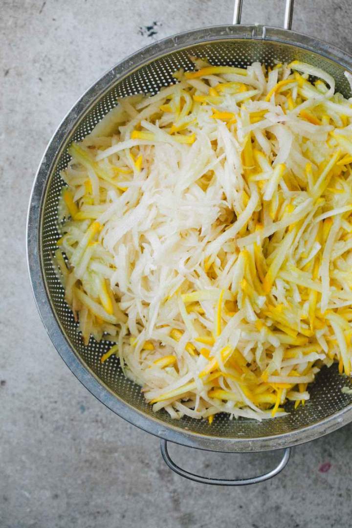 Grated zucchini and potatoes for Rösti (potato and zucchini fritters)