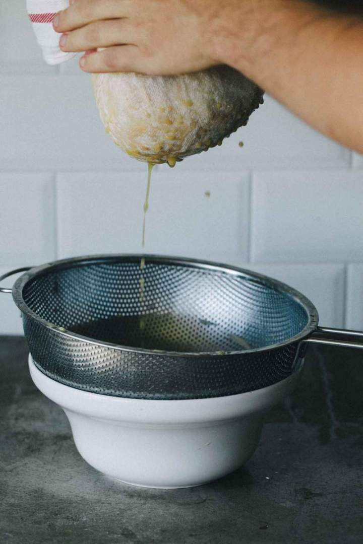 Draining zucchini and potatoes in a kitchen towel