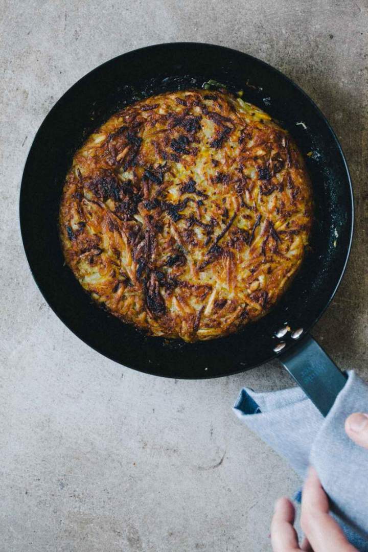 Rösti (potato and zucchini fritters) in a pan