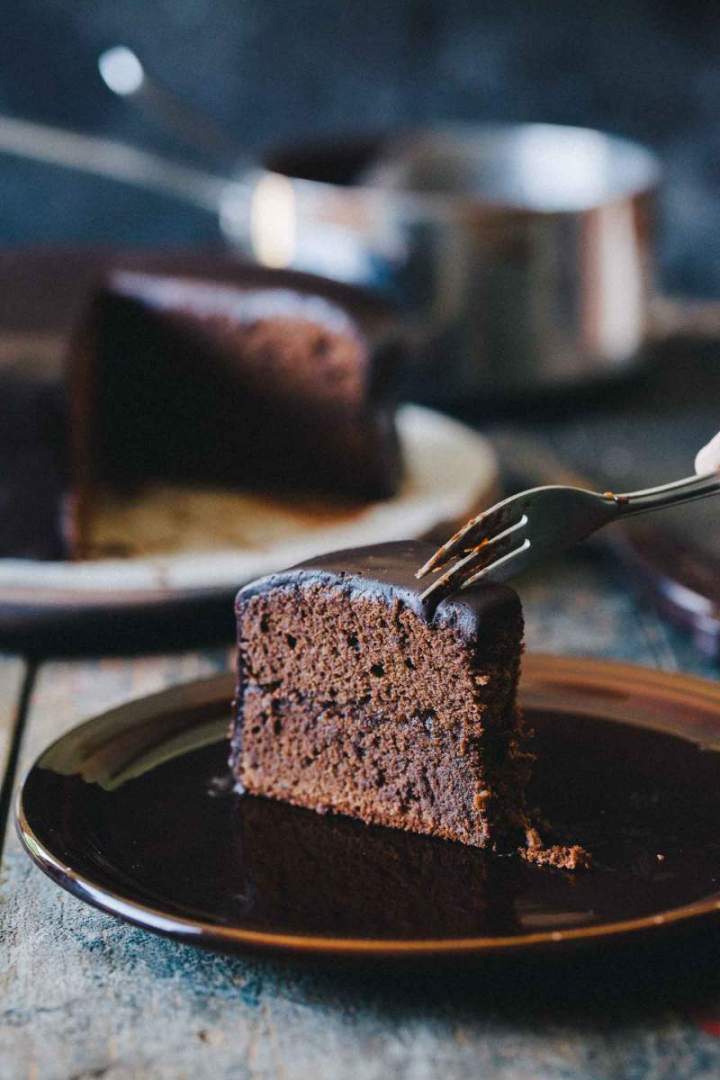 Sacher torte cut on slices with layers of chocolate and marmalade