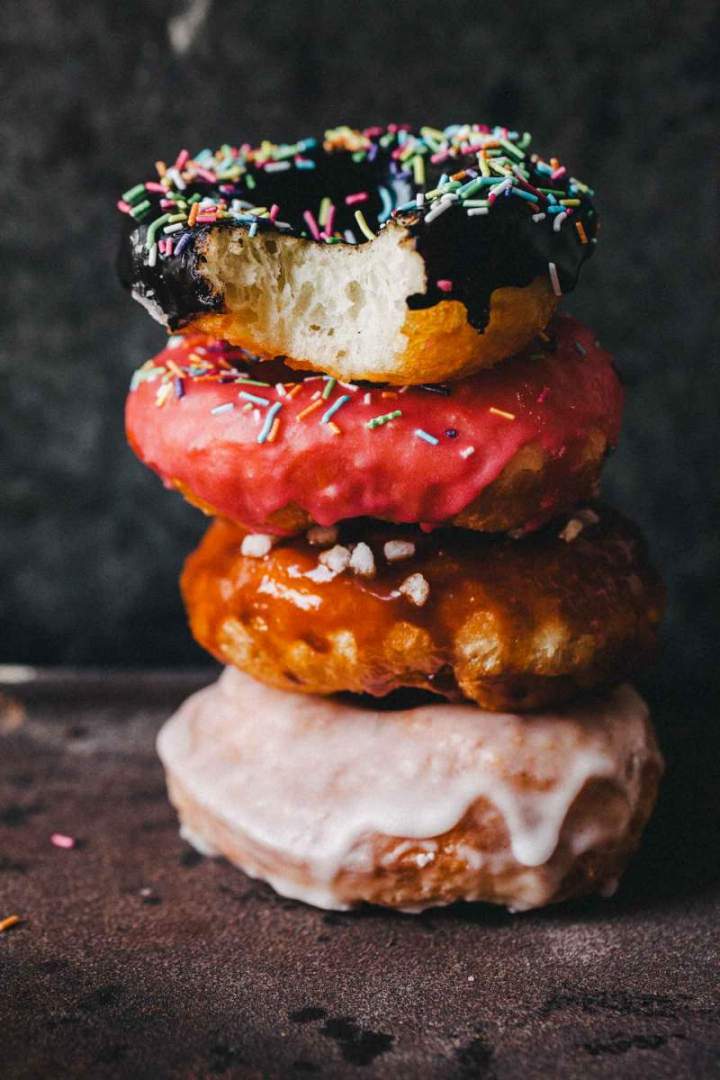 Sourdough doughnuts with chocolate and other colorful glazes