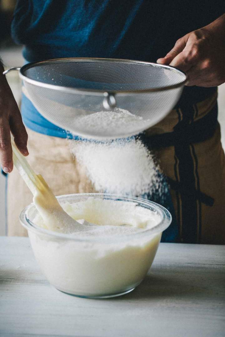 Preparing batter for Sponge Cake, sifting flour