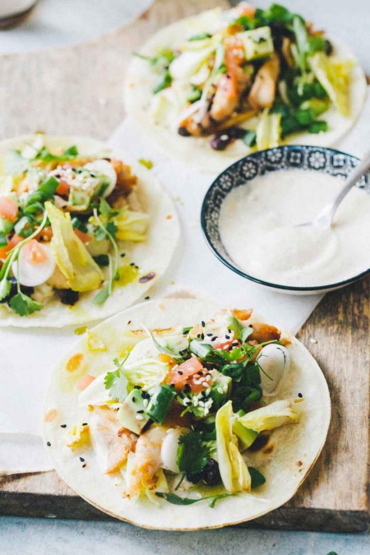 Tacos with spicy chicken wings and fresh topping