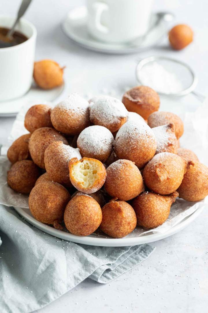 Yogurt sweet fritters sprinkled with icing sugar and served